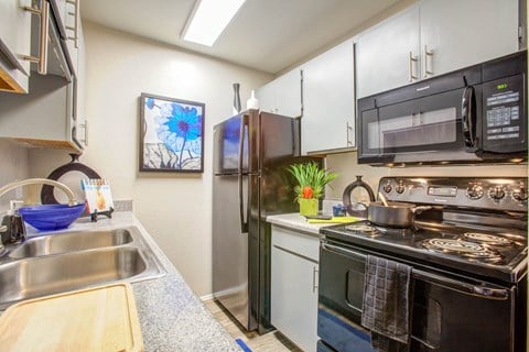 Spacious Kitchen With Pantry Cabinet at Verde Apartments, Tucson, AZ
